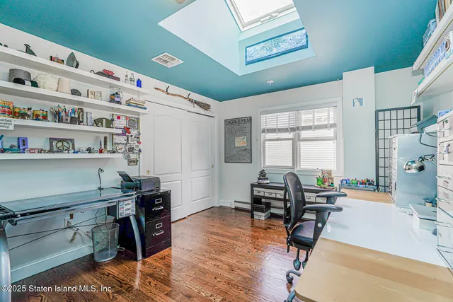 a bathroom with a tub shower vanity and mirror