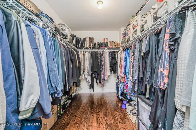 a view of an entryway with wooden floor
