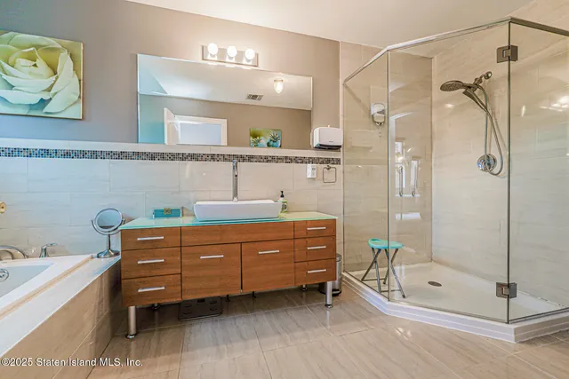 a large kitchen with cabinets table and chairs