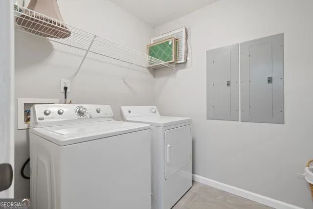 a utility room with dryer and washer
