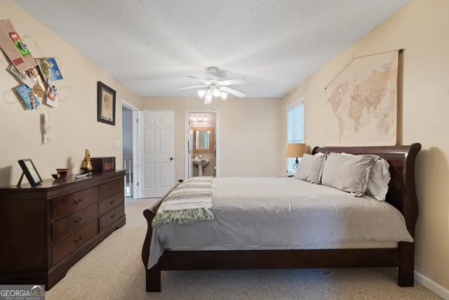 a bathroom with a sink toilet and a mirror