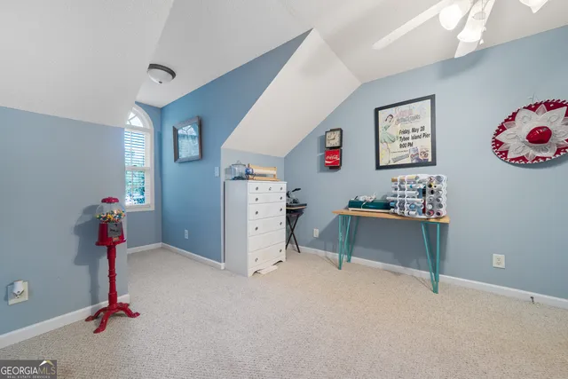 a view of room with workspace and toys