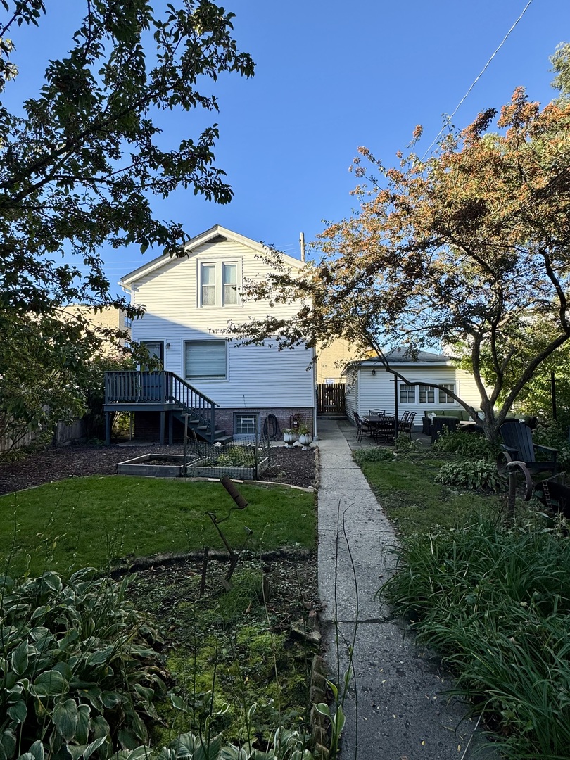 2604 West Winona Street, Unit 2W Chicago, IL 60625 - Photo 2 of 7 a front view of a house with garden