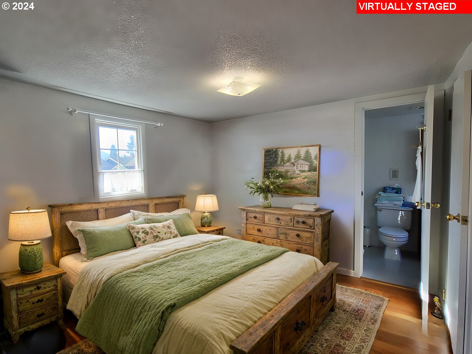 1936 H Street Springfield, OR 97477 - Photo 11 of 26 a bedroom with a bed and a tv on dresser