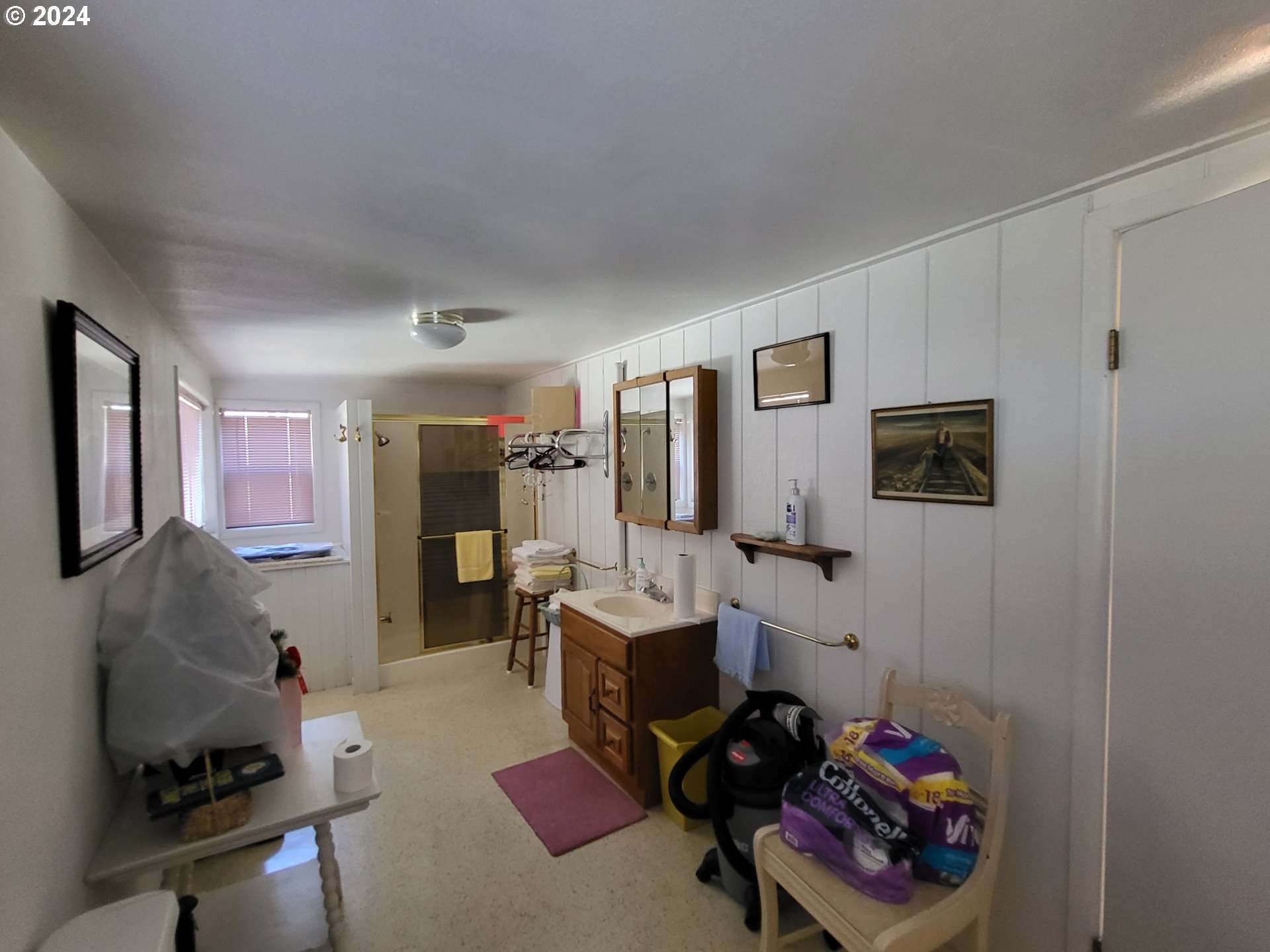 1936 H Street Springfield, OR 97477 - Photo 18 of 26 a room with furniture a flat screen tv and a window