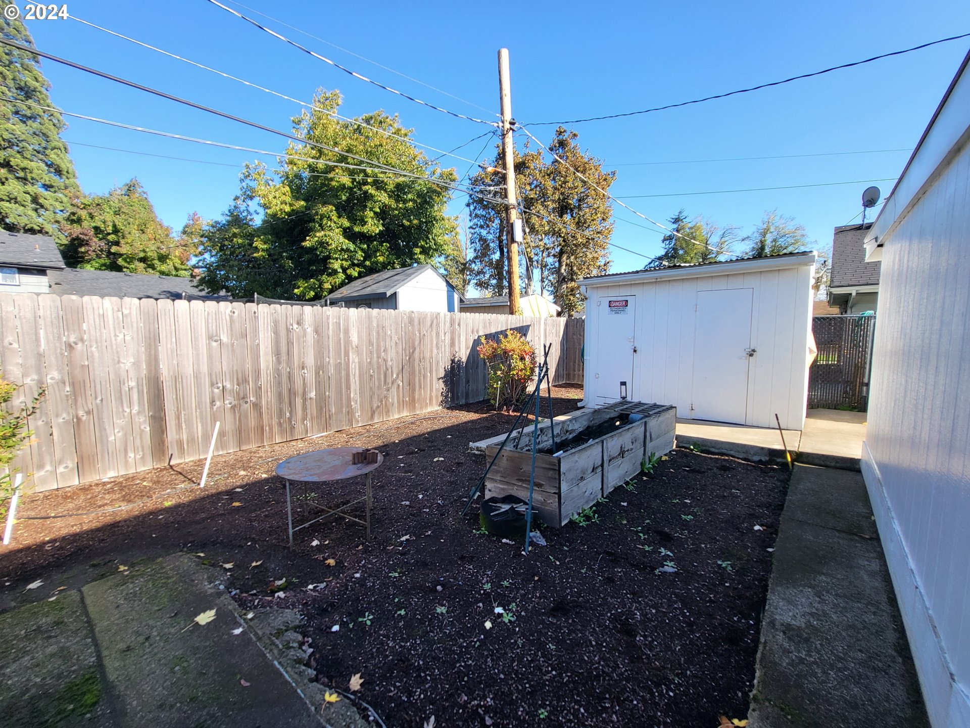 1936 H Street Springfield, OR 97477 - Photo 22 of 26 a backyard of a house with table and chairs