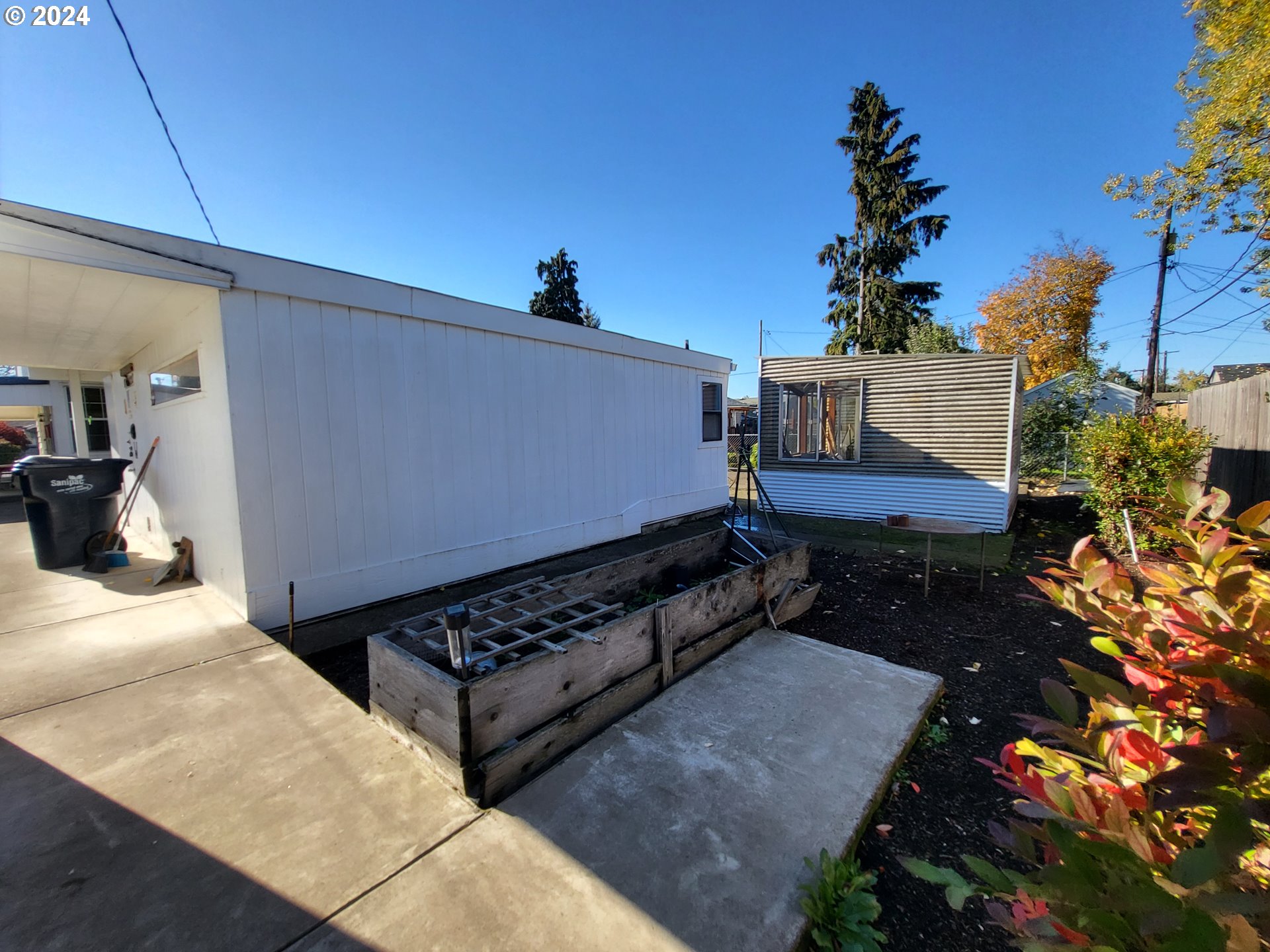 1936 H Street Springfield, OR 97477 - Photo 23 of 26 a backyard of a house with table and chairs