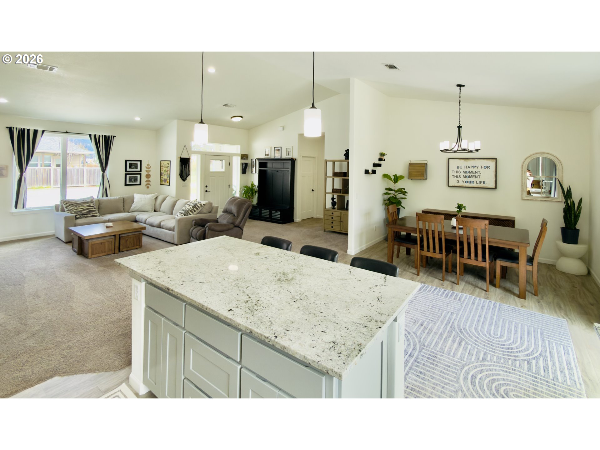 7205 Edge Cliff Drive Brookings, OR 97415 - Photo 12 of 30 a living room with furniture a dining table and chairs