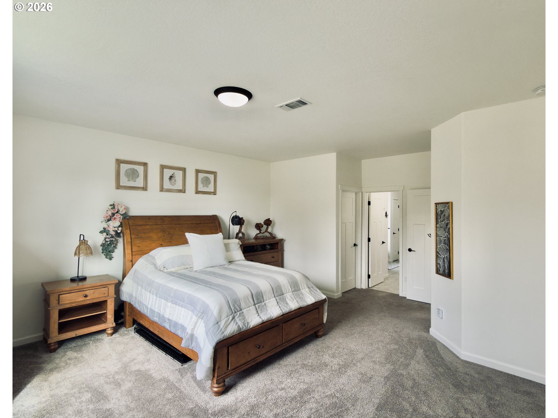 7205 Edge Cliff Drive Brookings, OR 97415 - Photo 15 of 30 a bedroom with a bed and a table