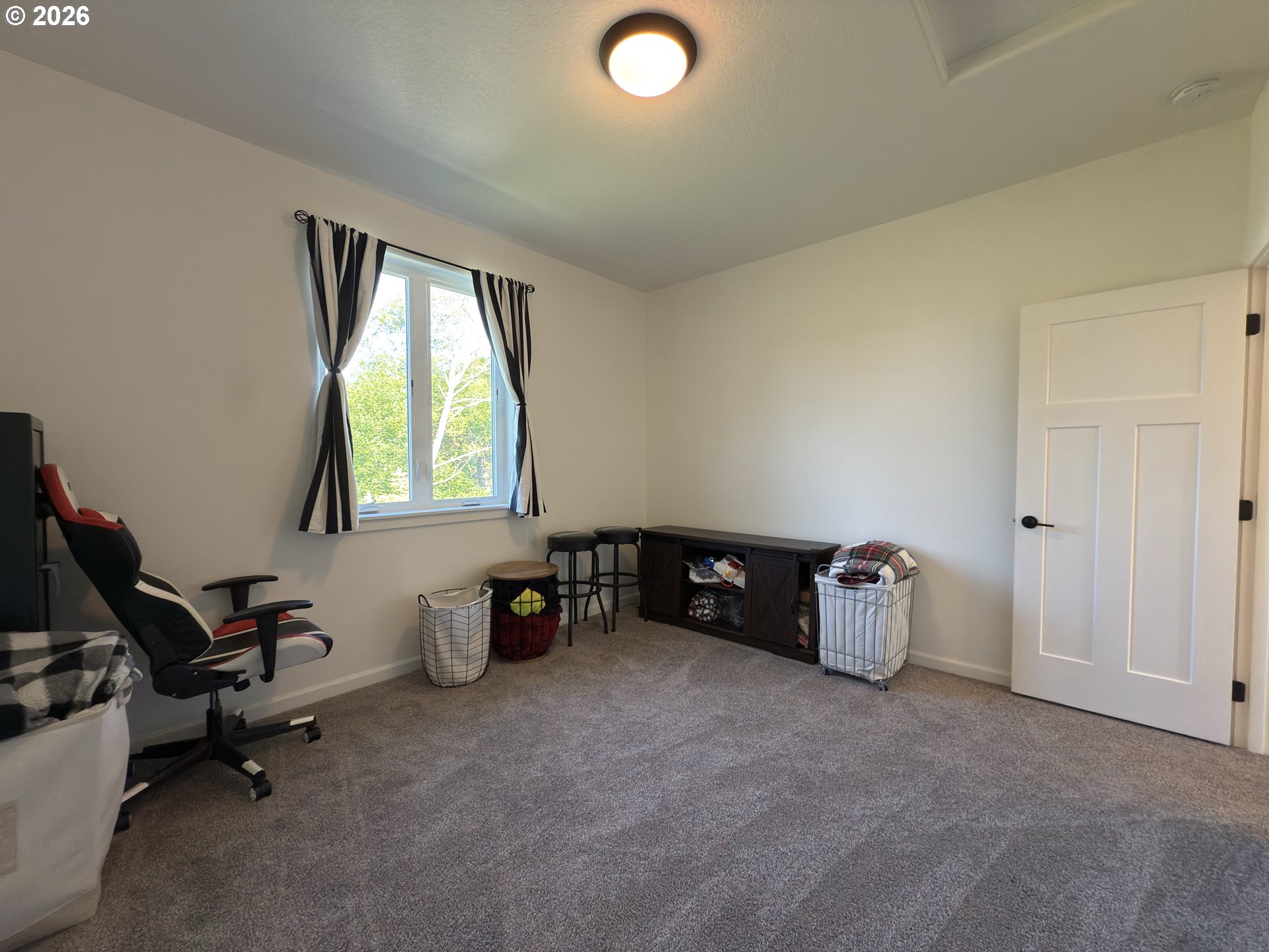 7205 Edge Cliff Drive Brookings, OR 97415 - Photo 21 of 30 a view of a workspace with furniture and a window