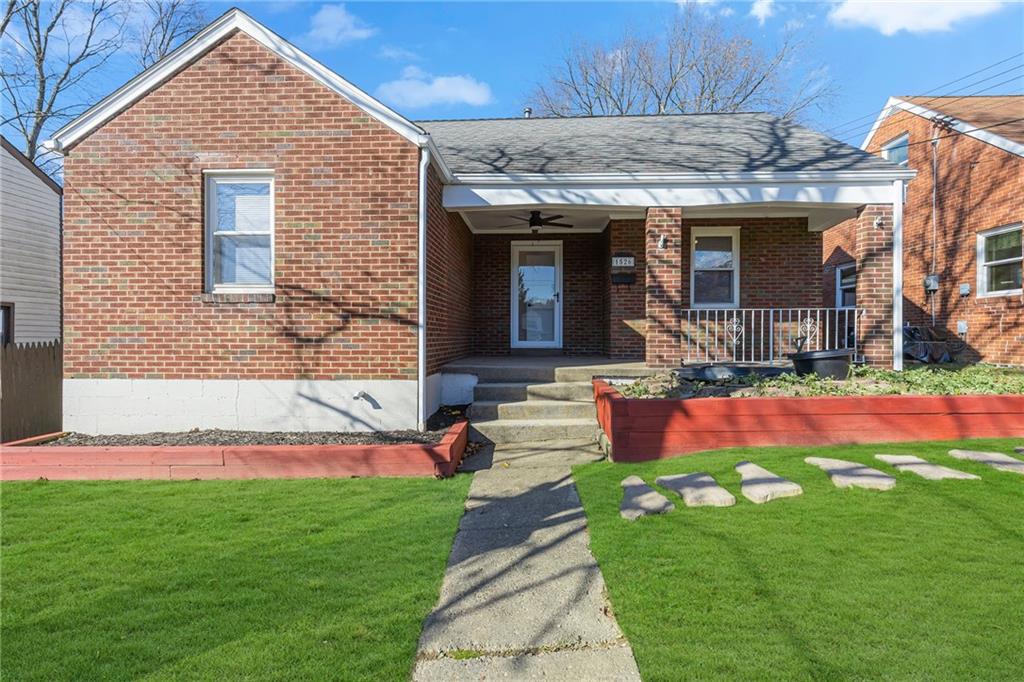 a front view of house with yard