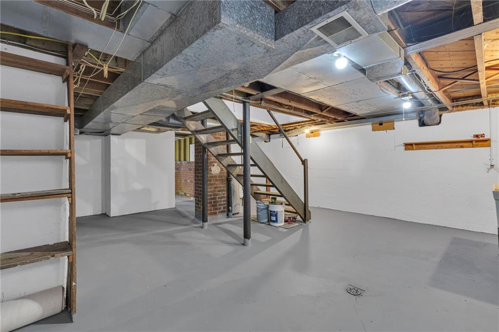 1526 Elgin Street Aliquippa, PA 15001 - Photo 18 of 33 a view of an empty room with stairs