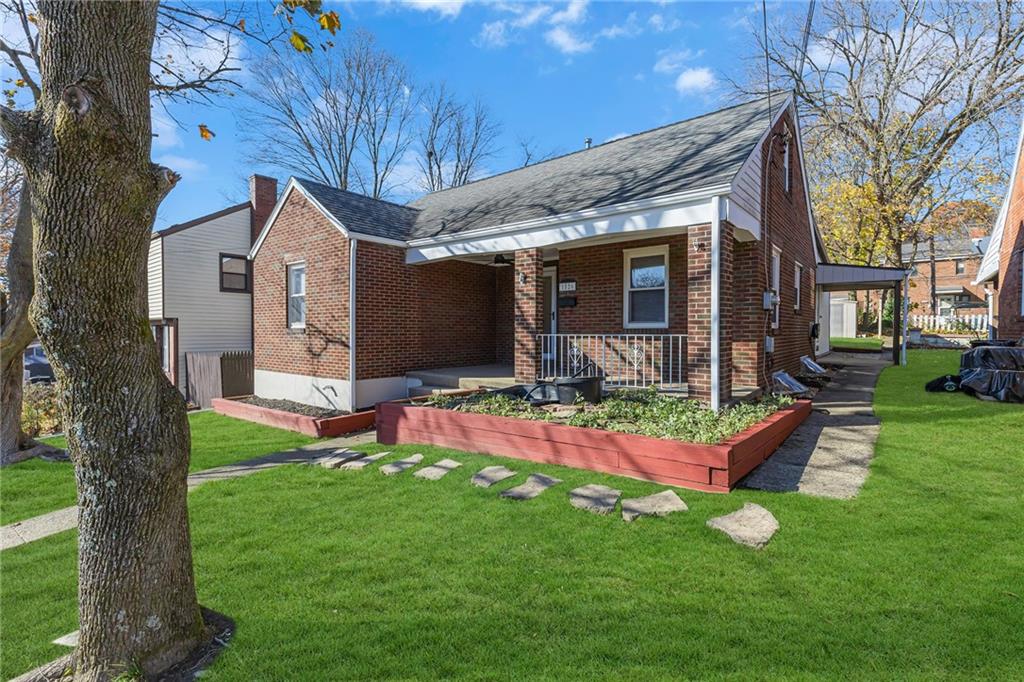 1526 Elgin Street Aliquippa, PA 15001 - Photo 2 of 33 a front view of house with yard and outdoor seating