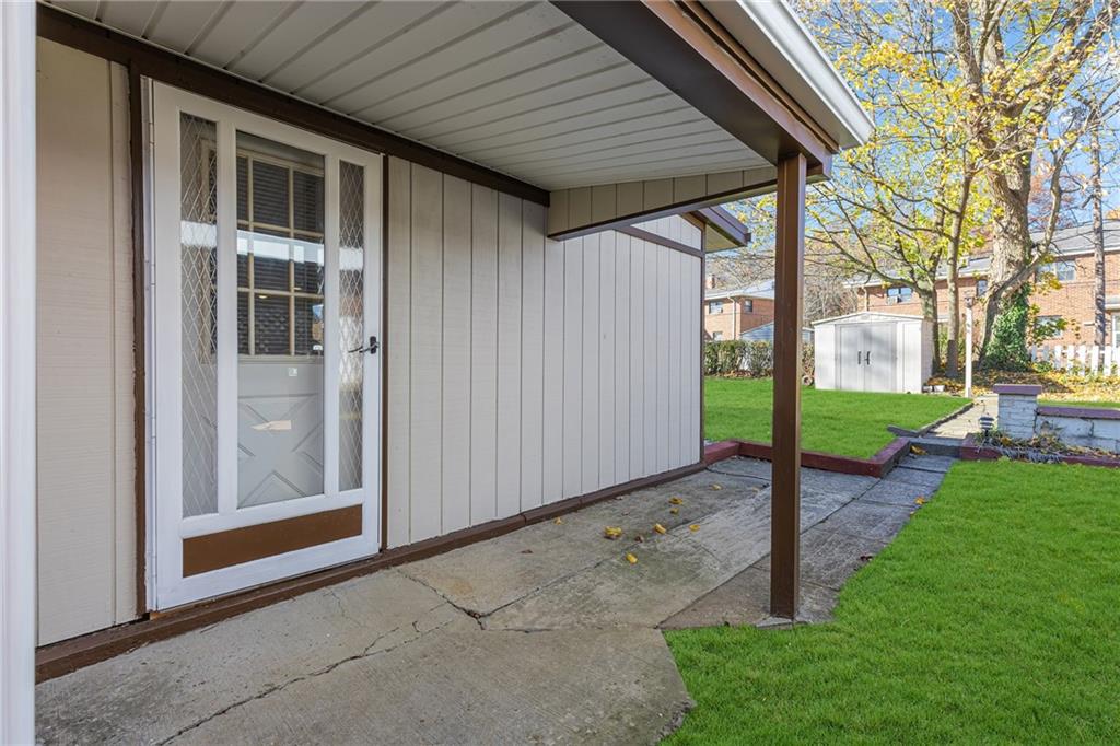 1526 Elgin Street Aliquippa, PA 15001 - Photo 23 of 33 a backyard of a house with fountain and entertaining space