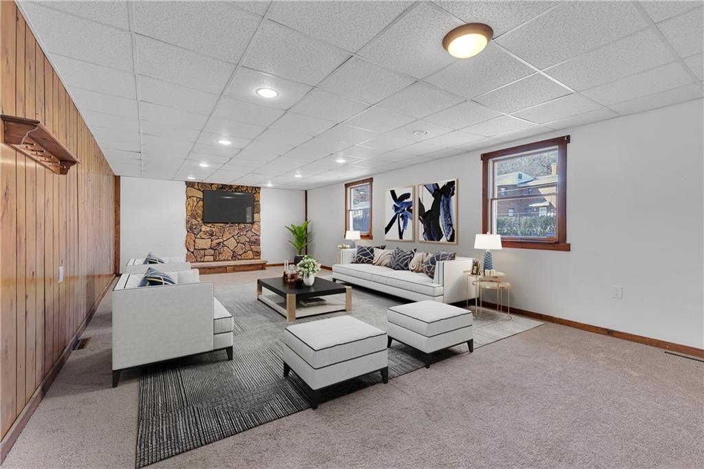 1526 Elgin Street Aliquippa, PA 15001 - Photo 31 of 33 a living room with furniture and a flat screen tv