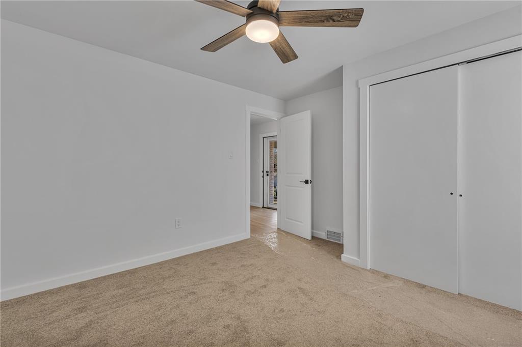 1526 Elgin Street Aliquippa, PA 15001 - Photo 9 of 33 a view of an empty room and chandelier fan