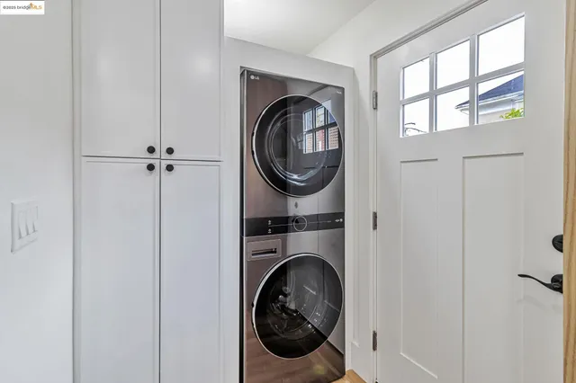 a view of a hallway with washer and dryer
