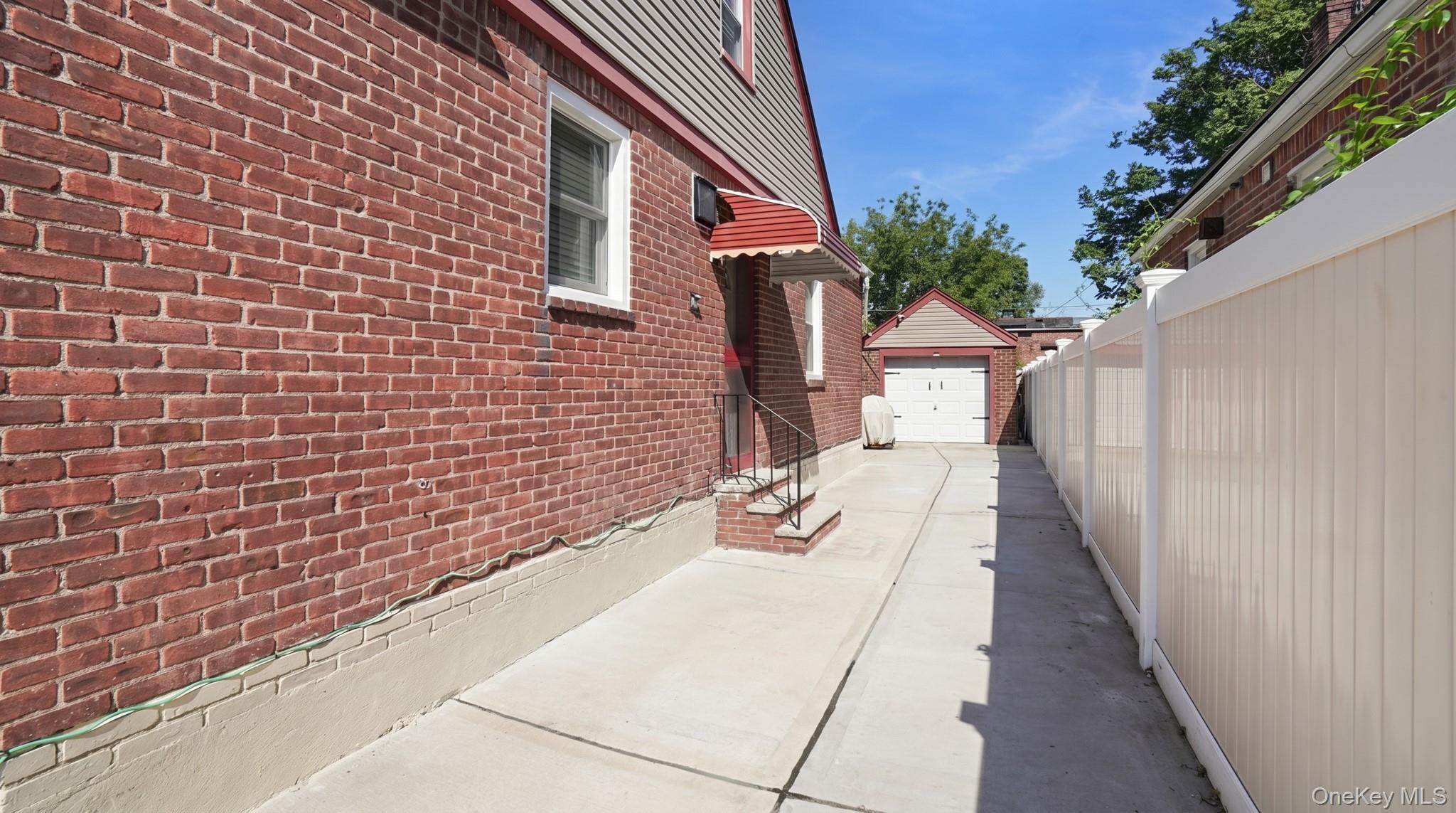 172-17 Amelia Road Queens, NY 11434 - Photo 16 of 18 a view of a pathway with a house