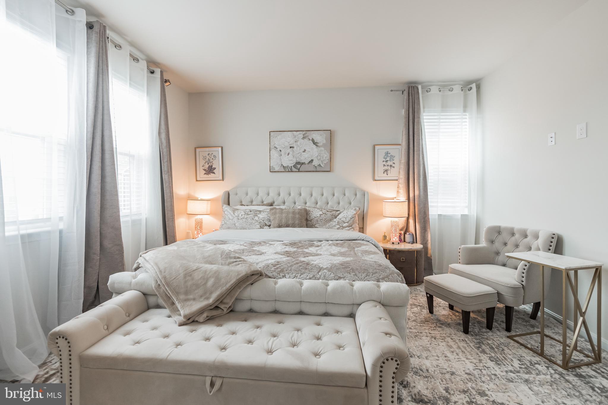 7041 Freedom Way Frederick, MD 21703 - Photo 14 of 32 a bedroom with a bed and a table