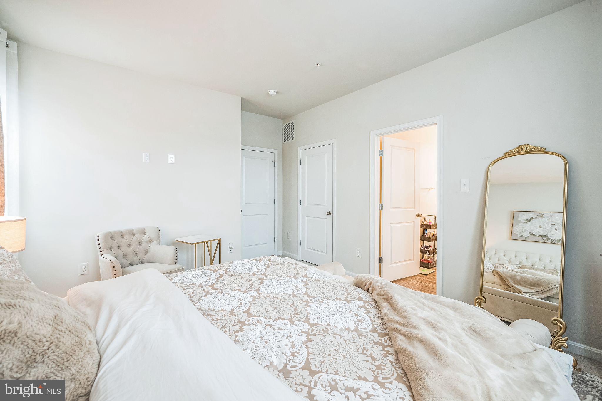 7041 Freedom Way Frederick, MD 21703 - Photo 15 of 32 a bedroom with a bed and a mirror