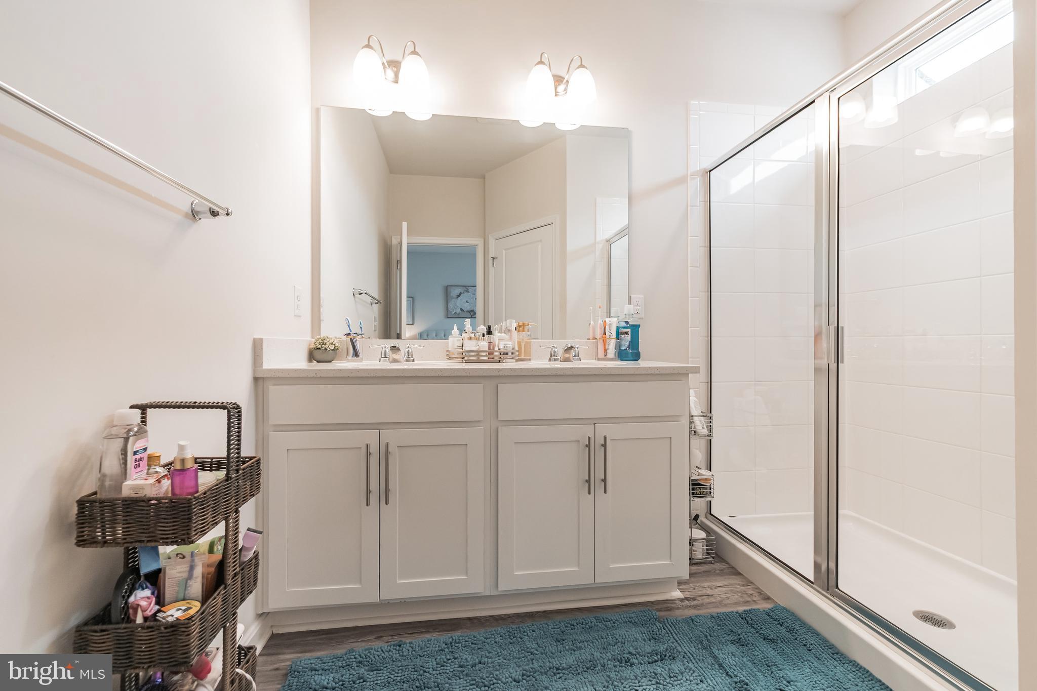 7041 Freedom Way Frederick, MD 21703 - Photo 16 of 32 a bathroom with a sink vanity and a mirror