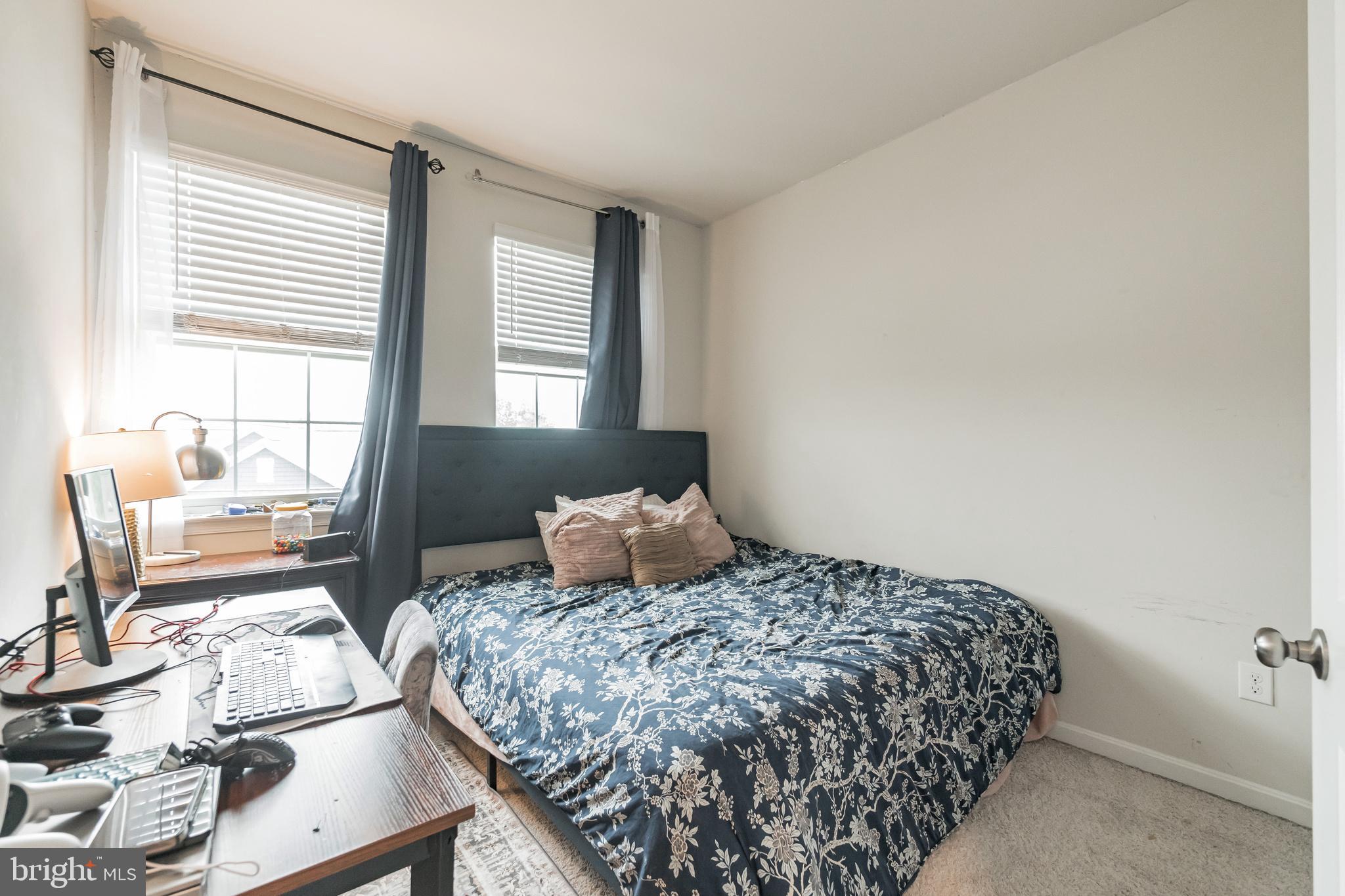 7041 Freedom Way Frederick, MD 21703 - Photo 19 of 32 a bedroom with a bed and wooden floor