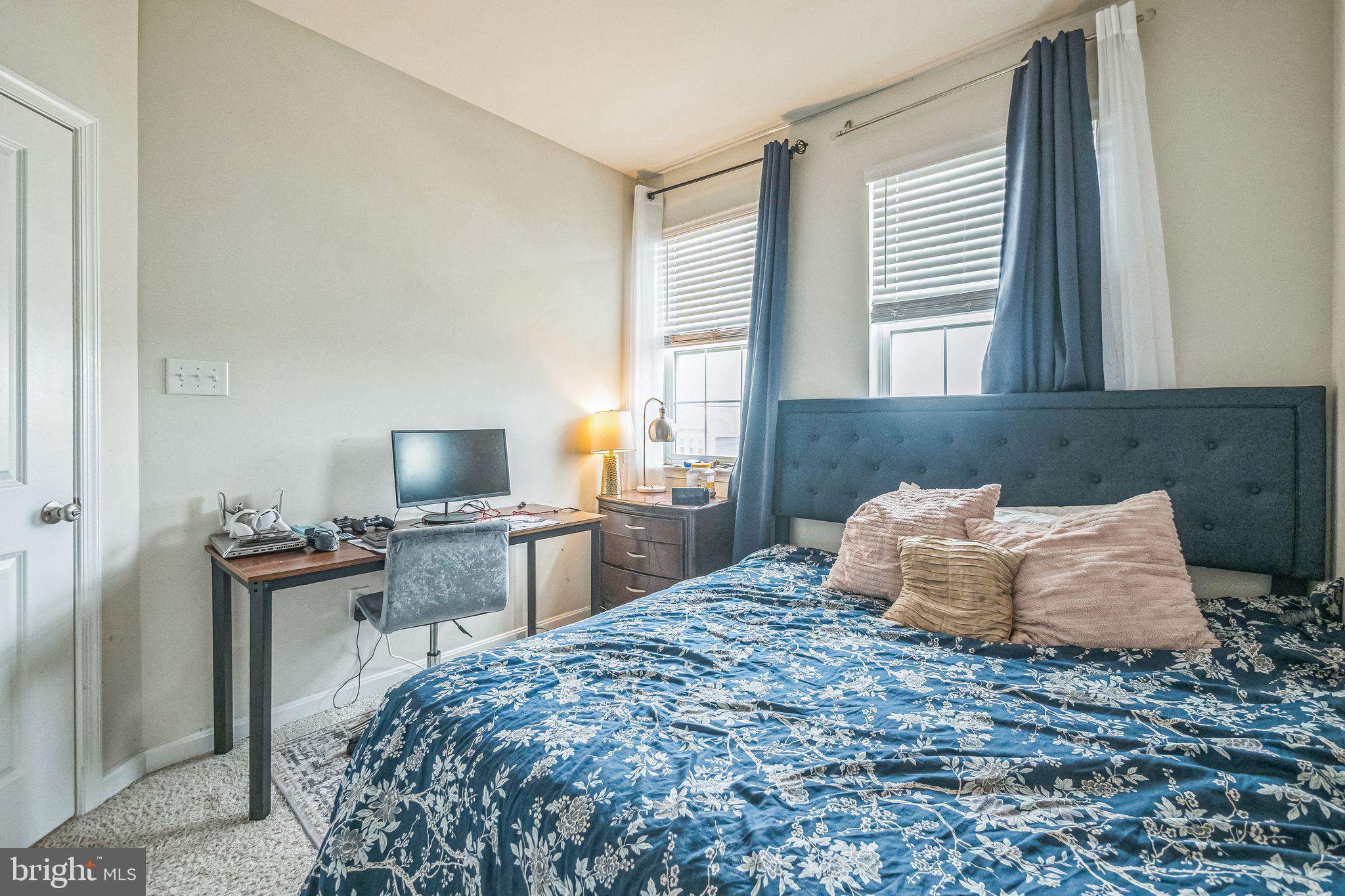 7041 Freedom Way Frederick, MD 21703 - Photo 20 of 32 a bedroom with a bed and wooden floor