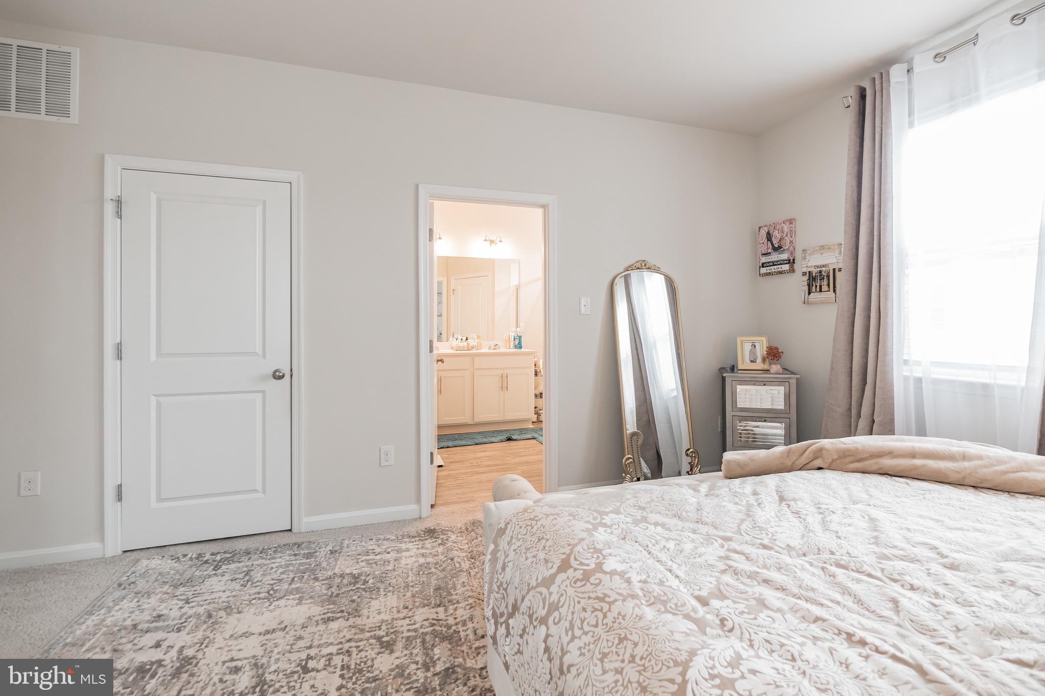 7041 Freedom Way Frederick, MD 21703 - Photo 21 of 32 a bedroom with a bed and a dresser