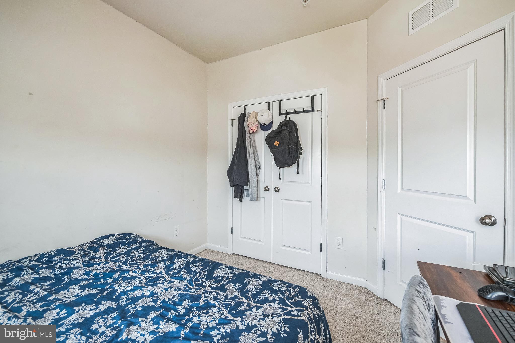 7041 Freedom Way Frederick, MD 21703 - Photo 23 of 32 a bedroom with a bed and a chair