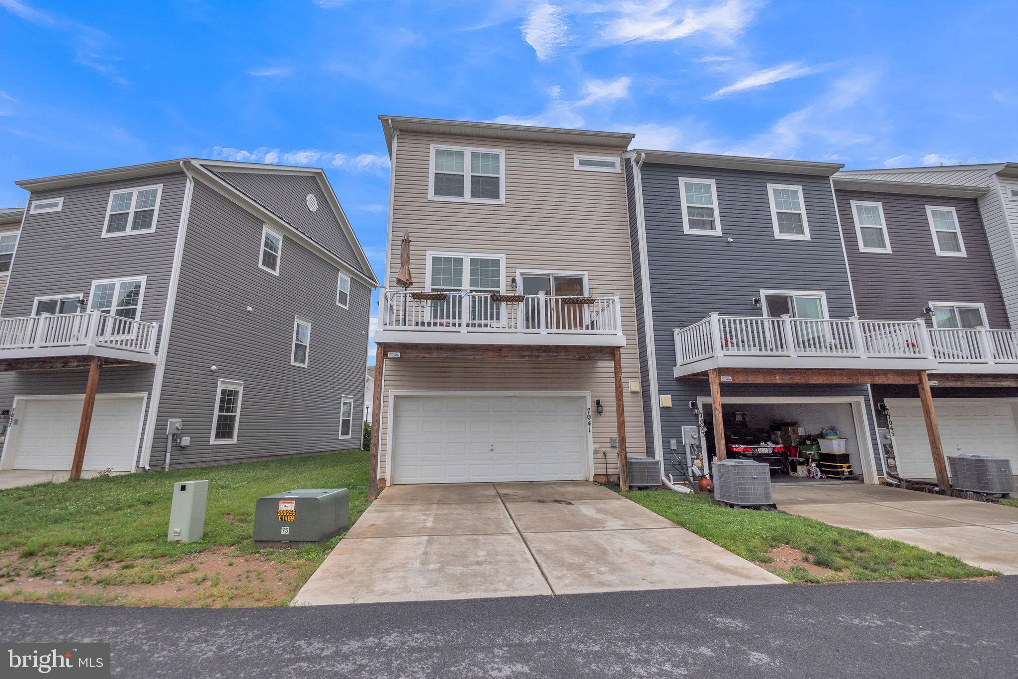 7041 Freedom Way Frederick, MD 21703 - Photo 27 of 32 a front view of building with yard
