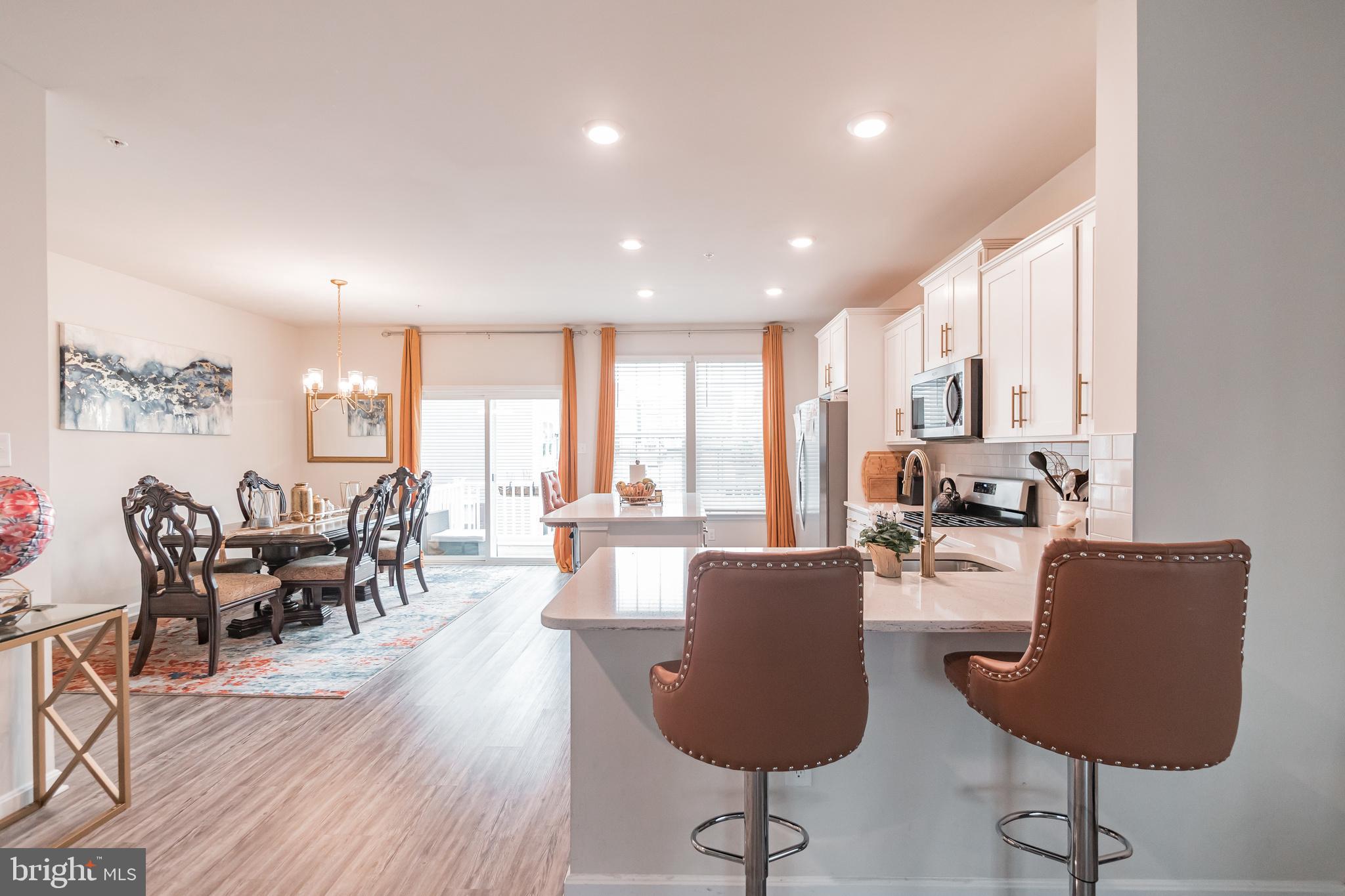 7041 Freedom Way Frederick, MD 21703 - Photo 5 of 32 a living room with furniture or couch and a large window