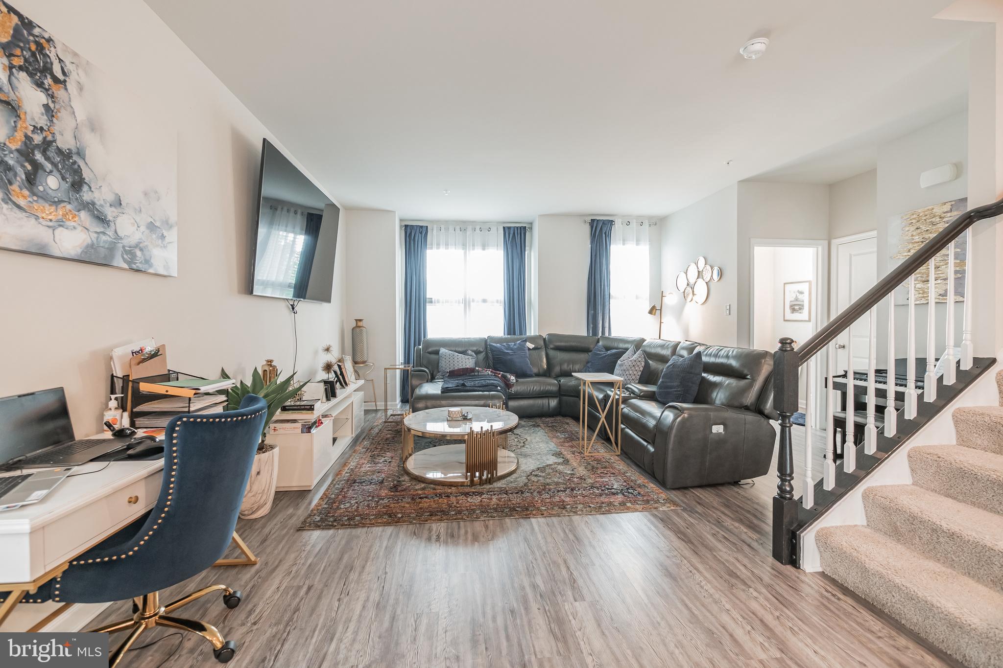 7041 Freedom Way Frederick, MD 21703 - Photo 6 of 32 a living room with furniture or couch and a wooden floor