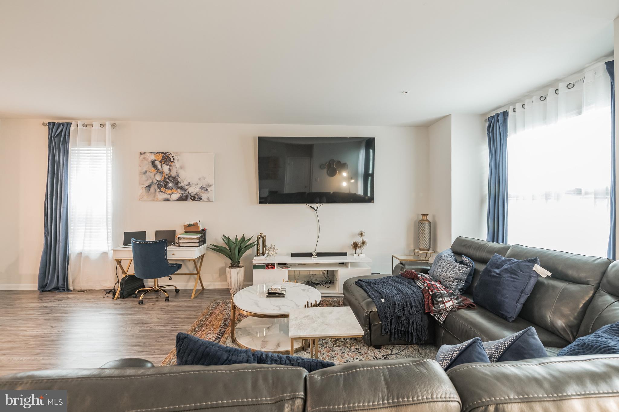 7041 Freedom Way Frederick, MD 21703 - Photo 9 of 32 a living room with furniture and wooden floor
