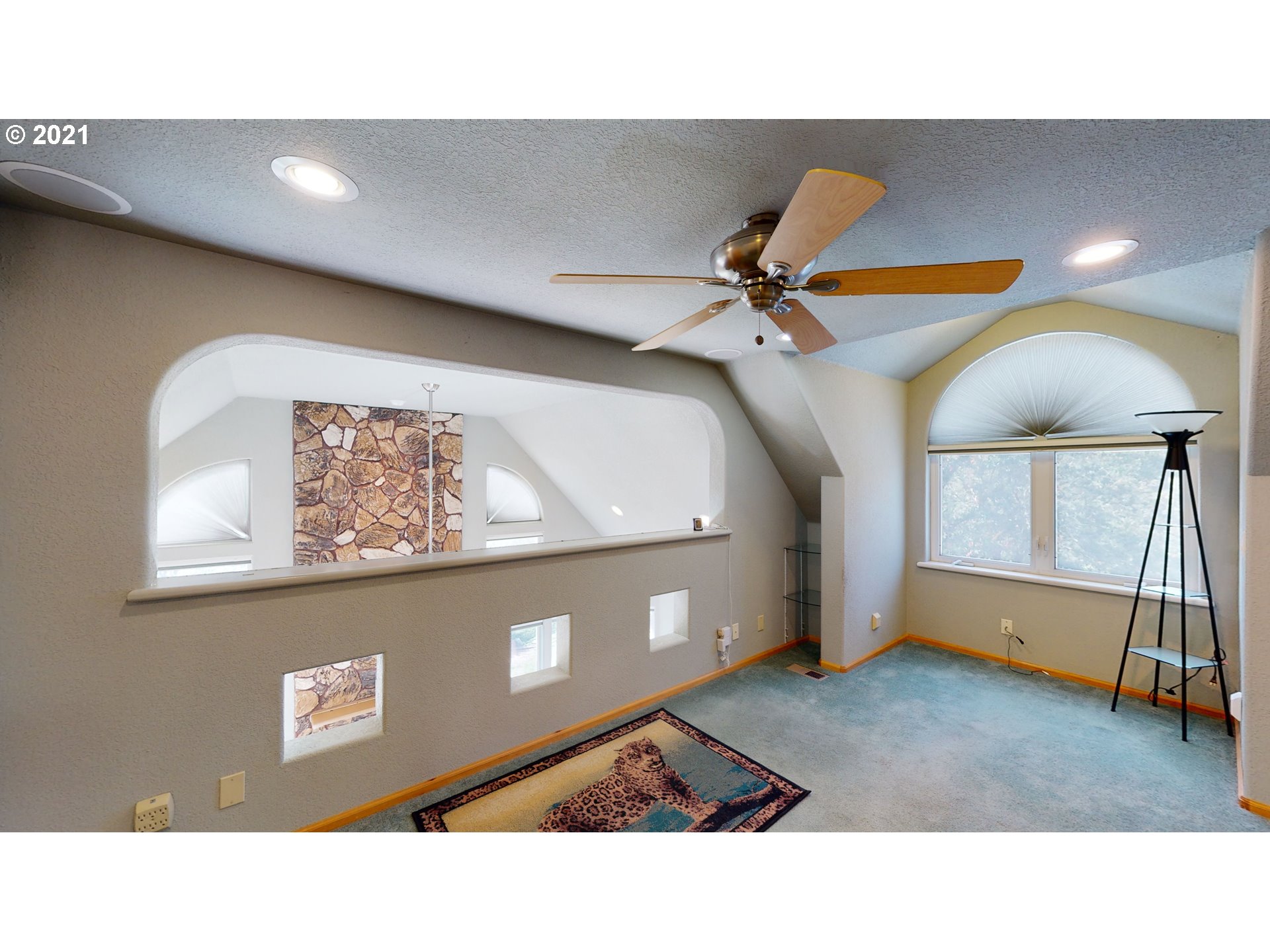 1265 Evergreen Ridge Road Riddle, OR 97469 - Photo 22 of 32 a living room with furniture and a ceiling fan