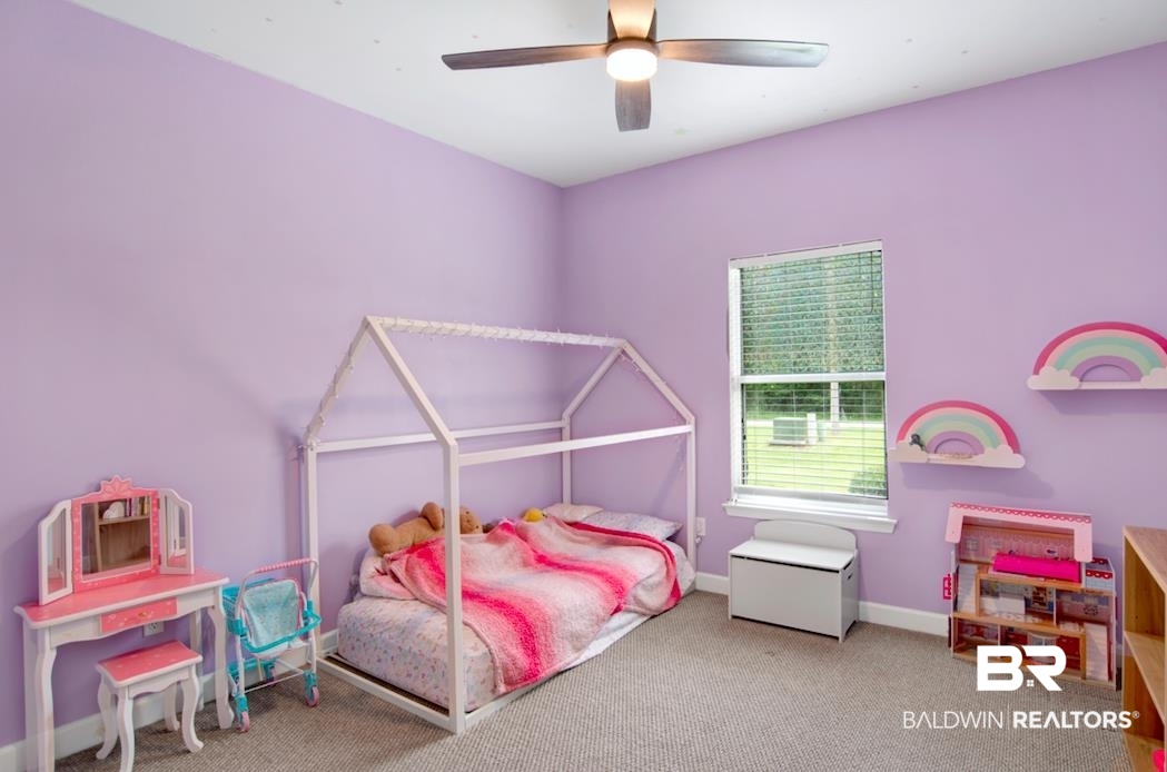 27545 Boaz Road West Loxley, AL 36551 - Photo 17 of 26 Carpeted bedroom featuring baseboards and ceiling fan