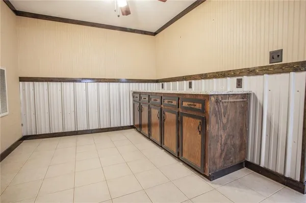 a view of a hallway with wooden walls