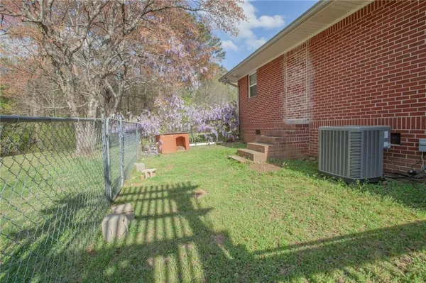 a view of backyard with seating area