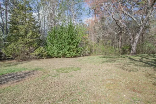 a view of outdoor space with yard and mountain view