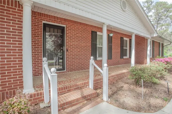 a front view of a house with a porch