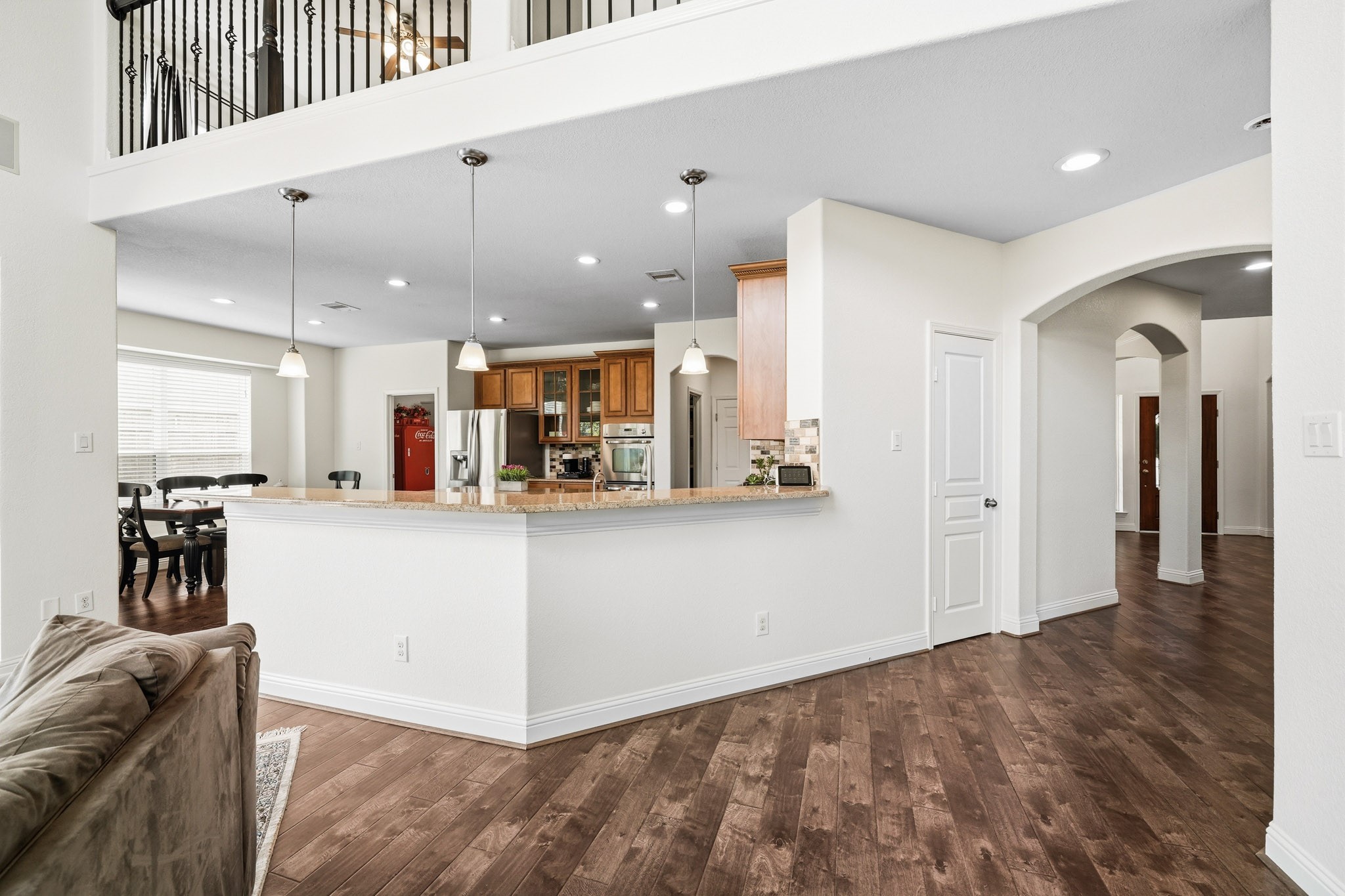 17610 Strackfield Lane Tomball, TX 77377 - Photo 10 of 50 The breakfast bar with pendant lighting offers an inviting space for morning coffee, casual dining, and effortless conversation. Added in 2025 to the home was a new roof, electrical panel with generator hookup, HVAC system and whole home surge Protector. Another new HVAC was added in 2024 along with two new water heaters.