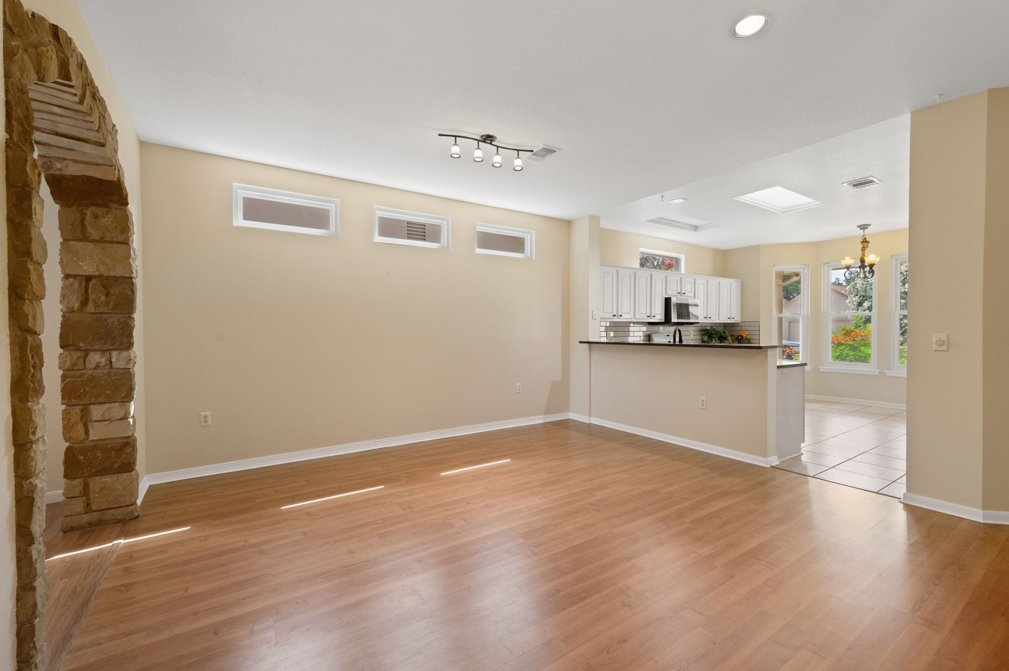118 Bass Street Georgetown, TX 78633 - Photo 39 of 40 An open floorplan seamlessly connects the living area to a well-appointed kitchen, creating an inviting space for gatherings.