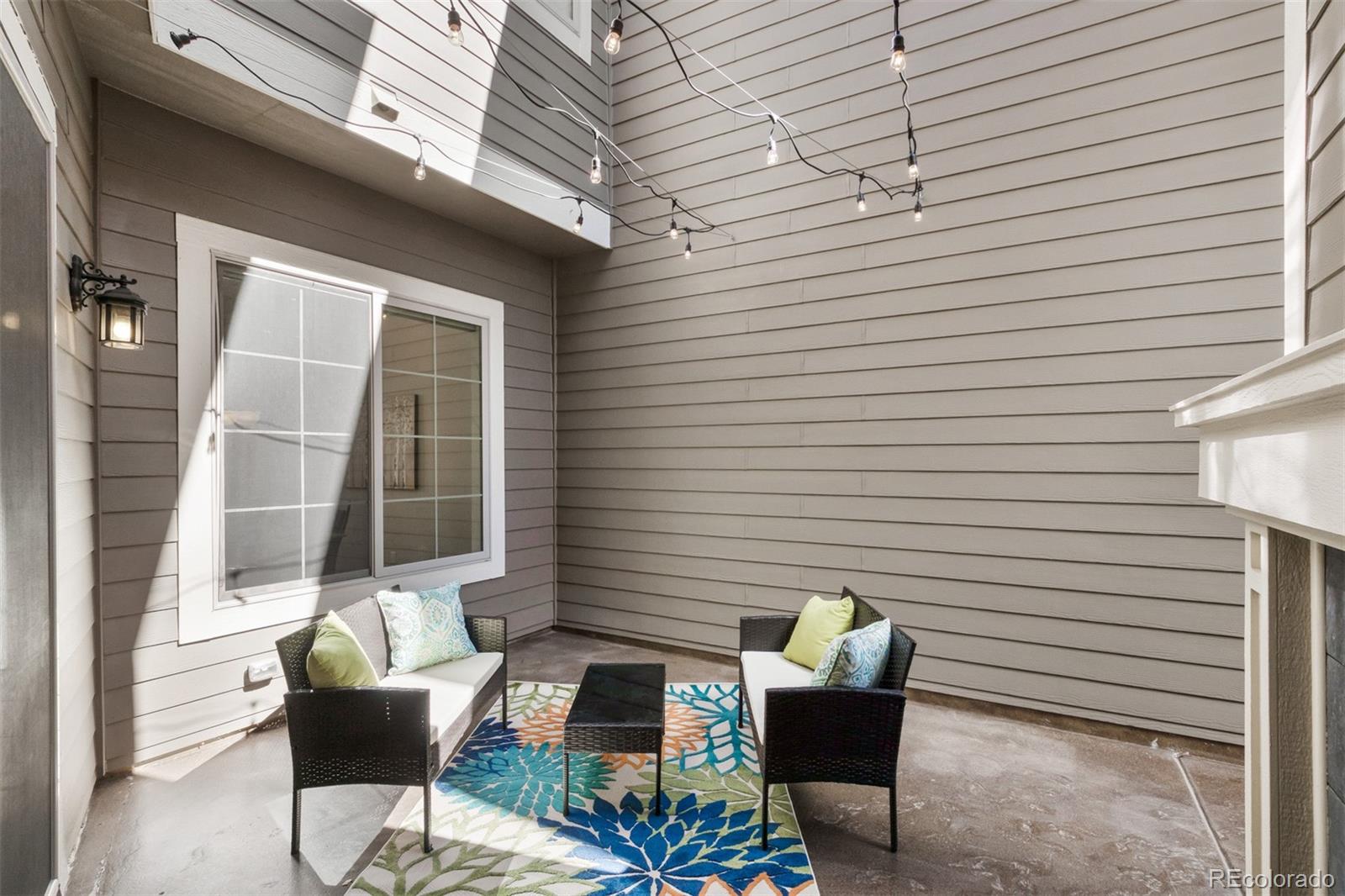 9256 Mornington Way Lone Tree, CO 80124 - Photo 17 of 36 a view of a patio with couple of chairs