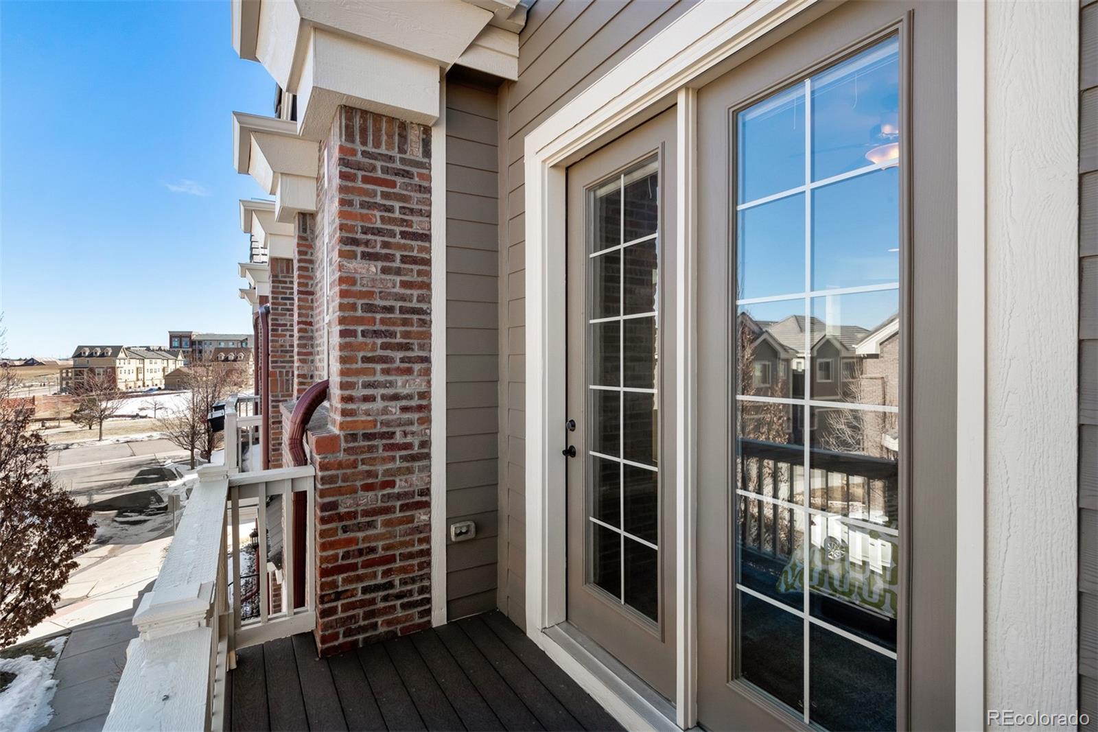 9256 Mornington Way Lone Tree, CO 80124 - Photo 22 of 36 a view of balcony with wooden floor
