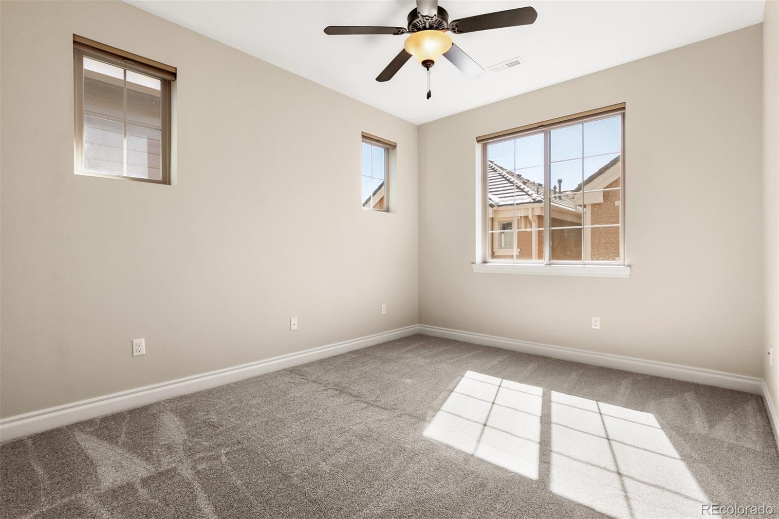 9256 Mornington Way Lone Tree, CO 80124 - Photo 26 of 36 a view of an empty room with a window