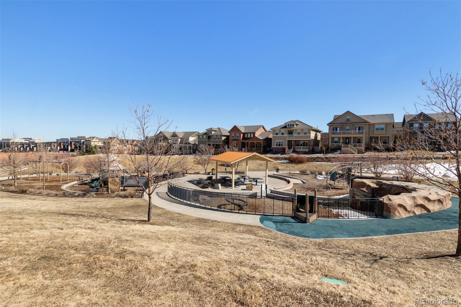 9256 Mornington Way Lone Tree, CO 80124 - Photo 33 of 36 a view of a house with a yard and ocean view