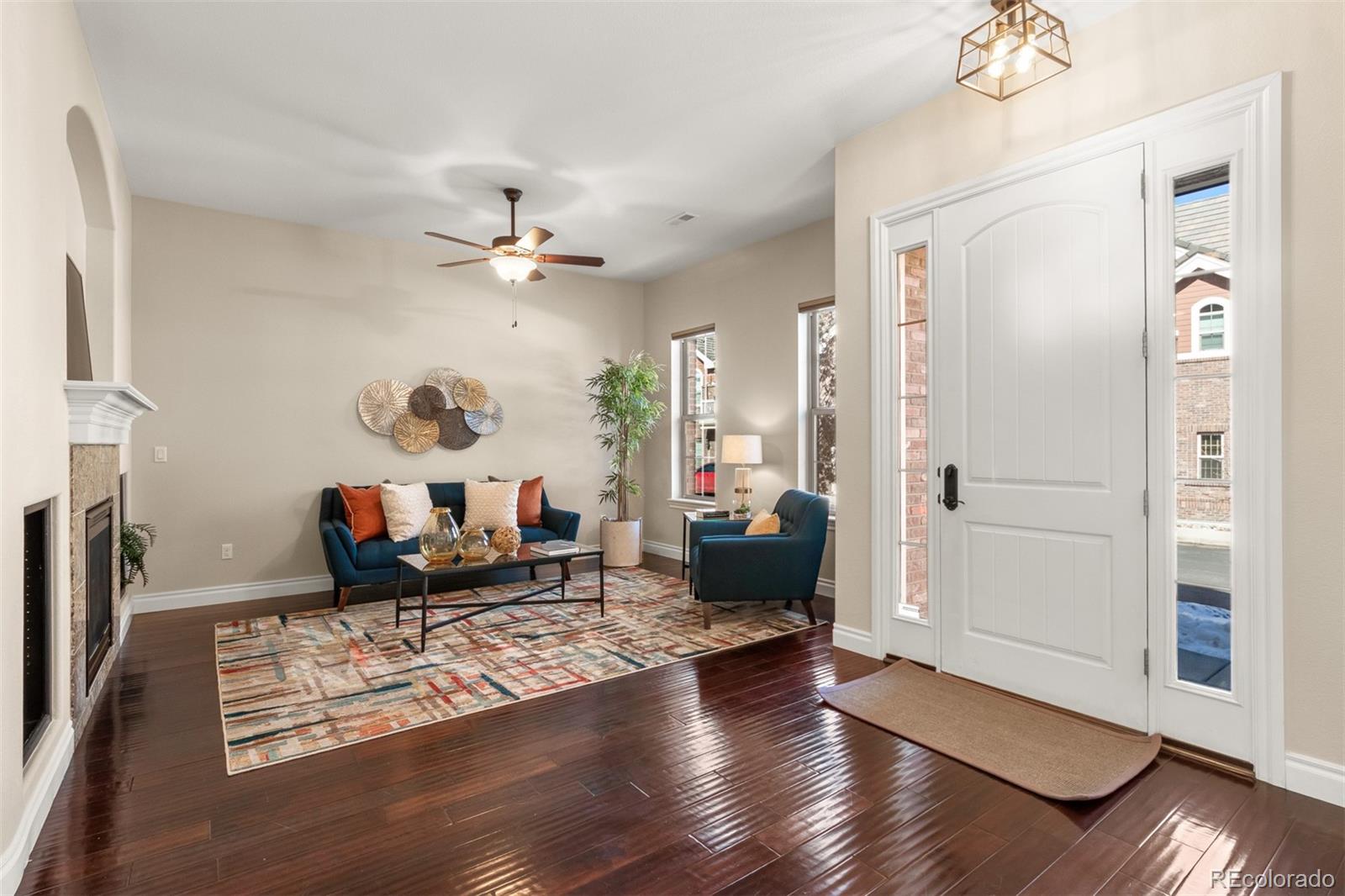 9256 Mornington Way Lone Tree, CO 80124 - Photo 5 of 36 a living room with furniture and wooden floor