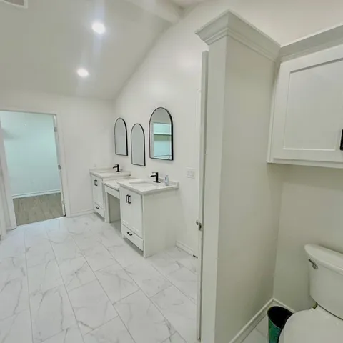 a spacious bathroom with a bathtub and shower