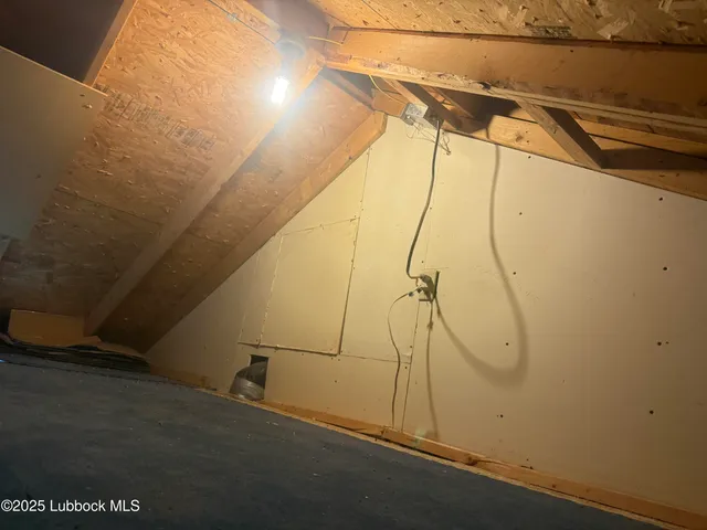 an empty room with window and a ceiling fan