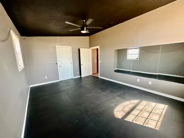 a bathroom with a toilet and a shower curtain