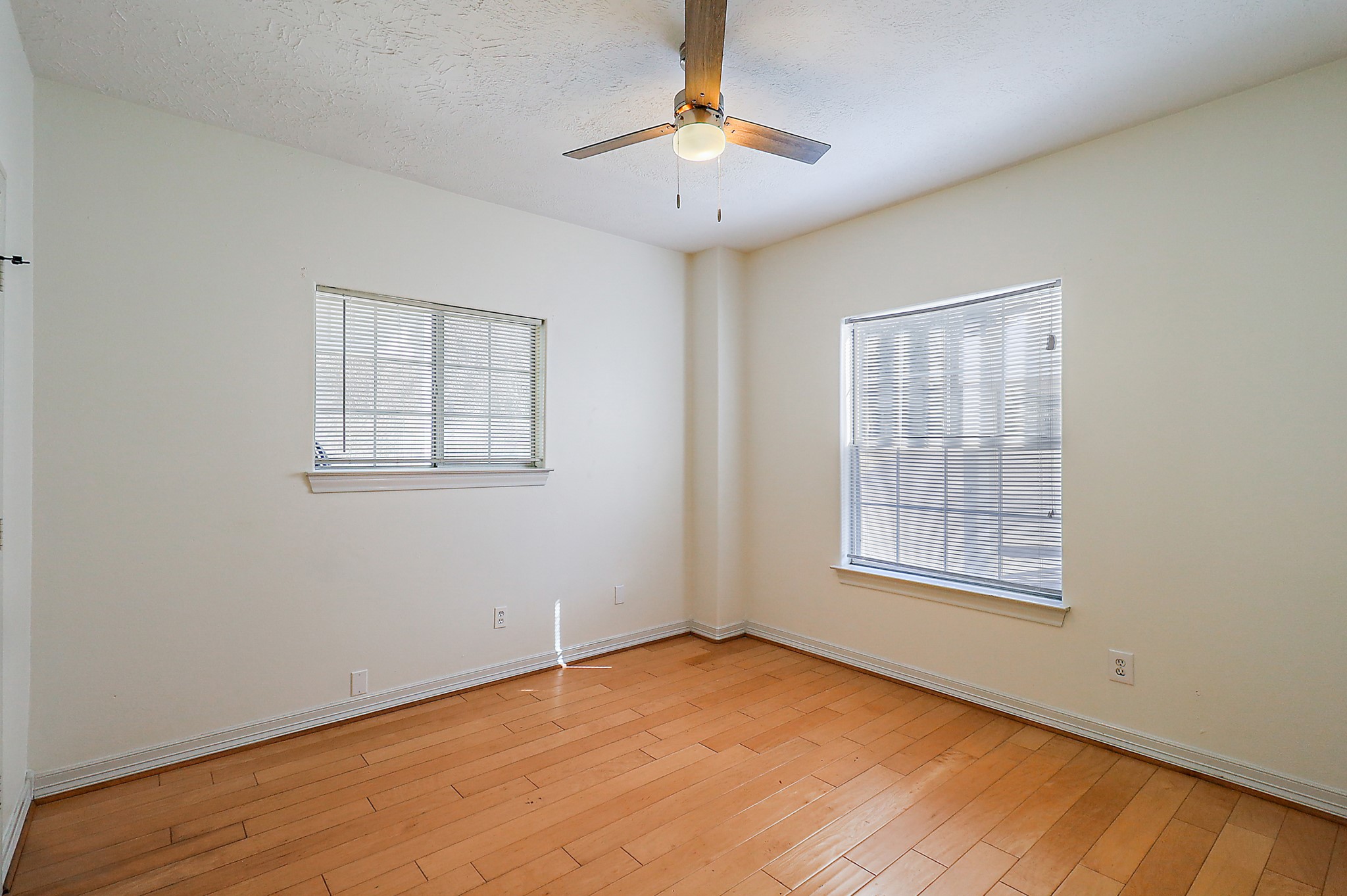 1306 Spring Branch Drive Baytown, TX 77523 - Photo 19 of 38 an empty room with chandelier fan and windows